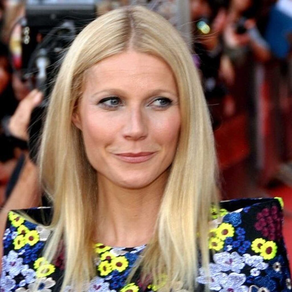 Gwyneth Paltrow has a square face shape, characterized by a strong jawline, broad forehead, and angular features, giving her face a well-defined and symmetrical appearance.