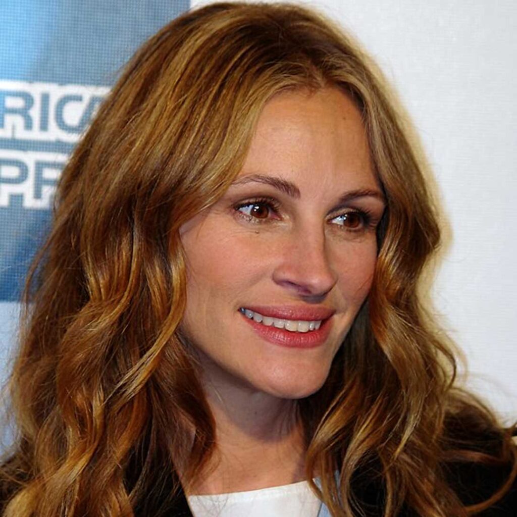 Julia Roberts has an oval face shape, characterized by balanced proportions, high cheekbones, and a slightly narrower jawline and forehead.