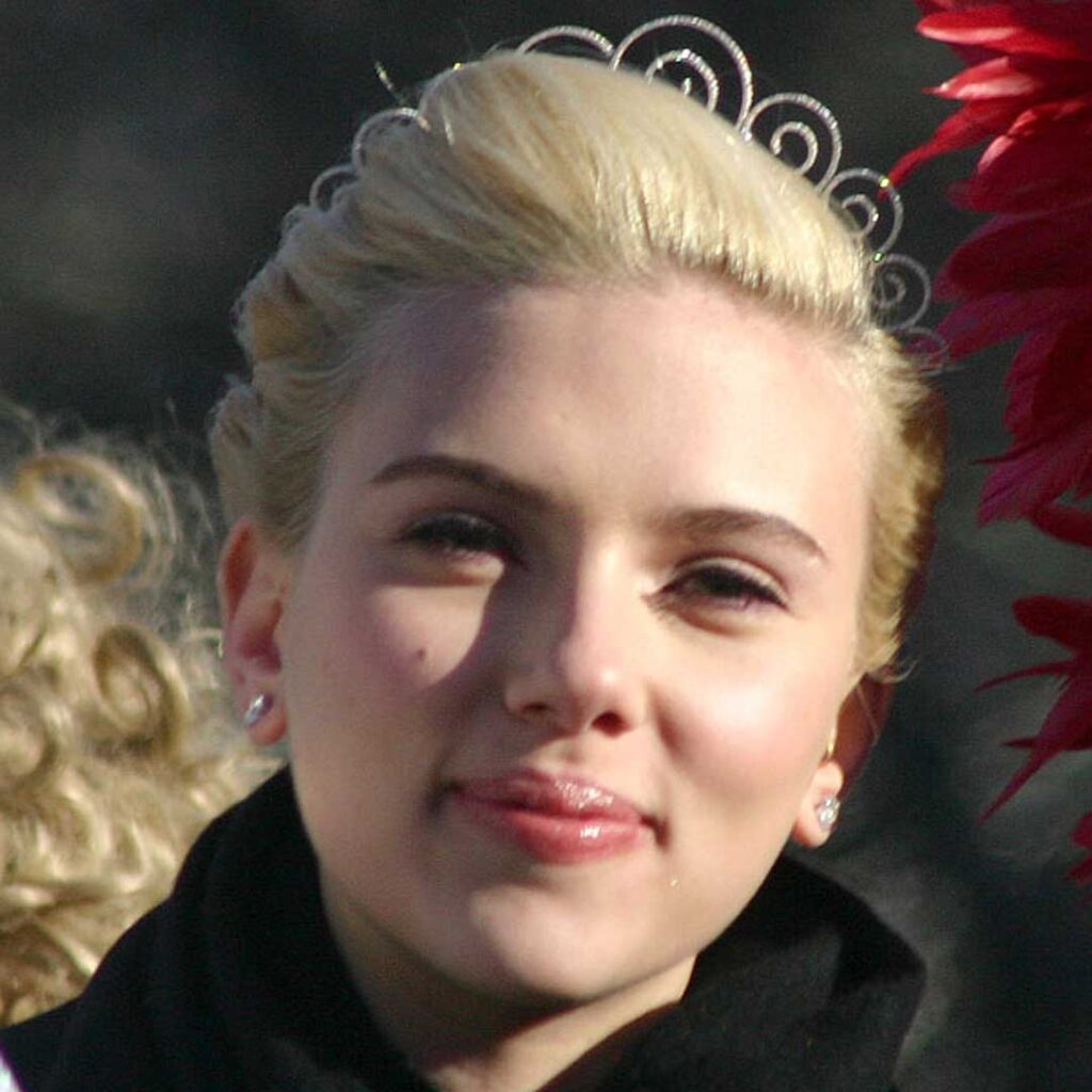 Scarlett Johansson has a diamond face shape, characterized by wide cheekbones, a narrow forehead, and a pointed chin, giving her face a uniquely angular and balanced appearance.