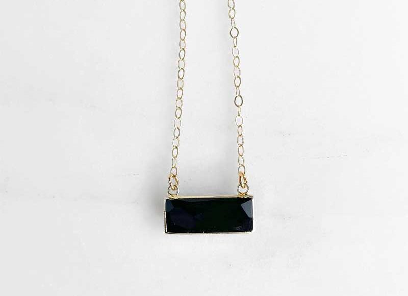 Faceted black onyx bar necklace on a delicate 14K gold-filled chain, styled against a clean white background.