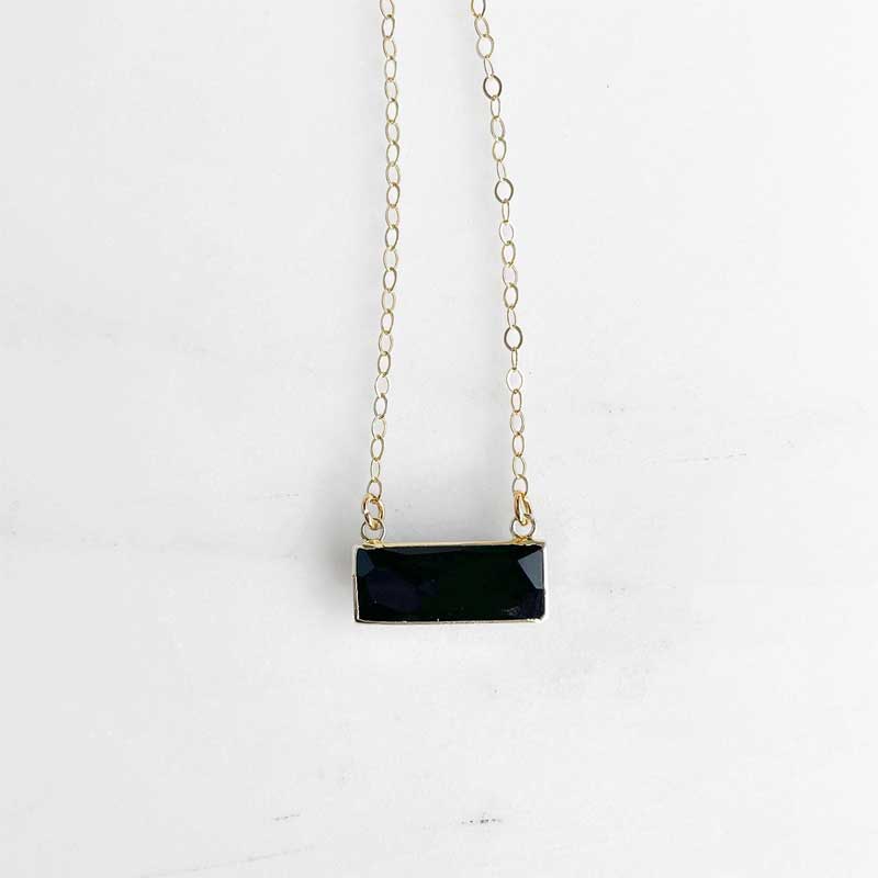 Faceted black onyx bar necklace on a delicate 14K gold-filled chain, styled against a clean white background.