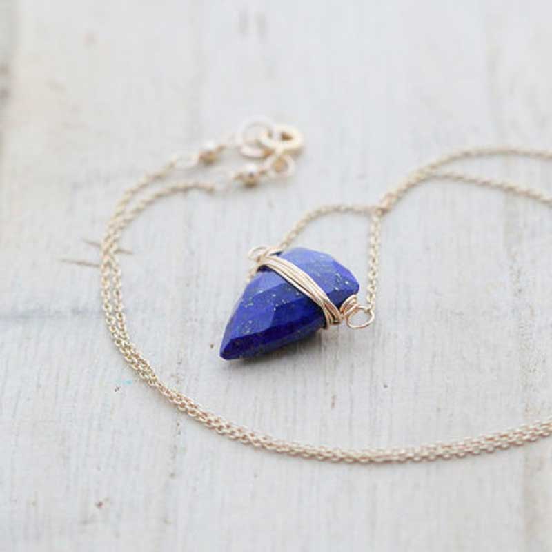 Horizontal Lapis Lazuli briolette pendant wrapped in gold wire on a delicate gold-filled chain