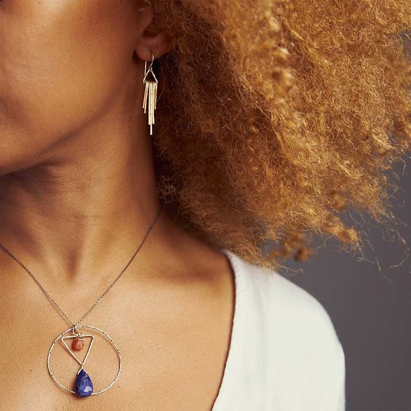 Woman wearing Lapis Contrast Pendant Necklace featuring lapis lazuli and carnelian with mixed metal design