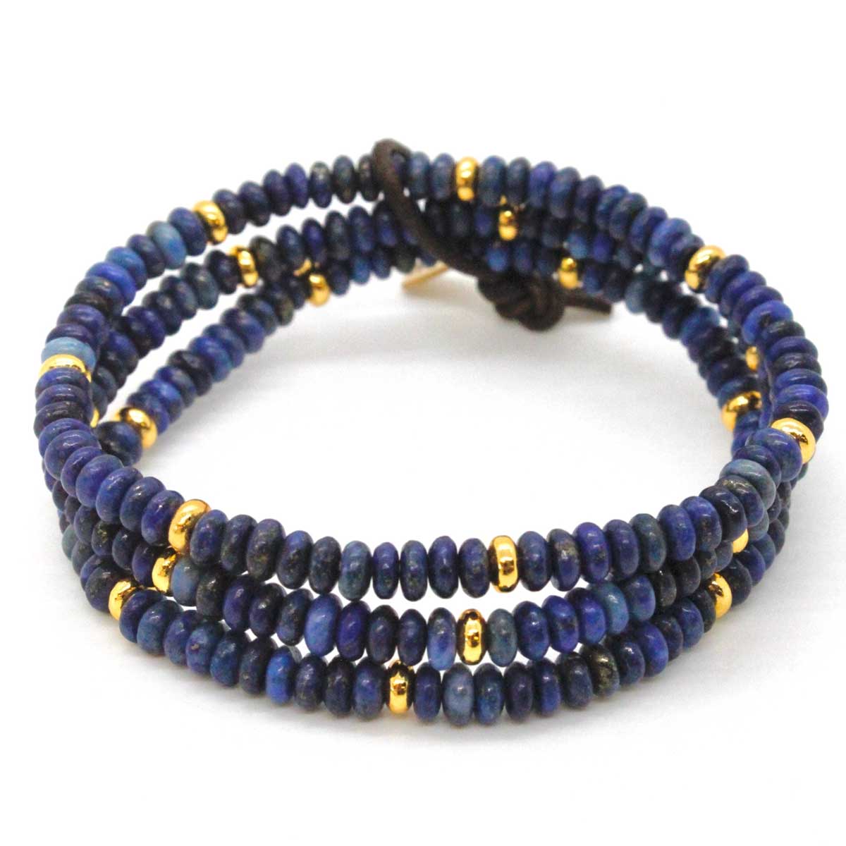 Top view of LIZOU’s triple-row lapis lazuli and gold bracelet tied with leather