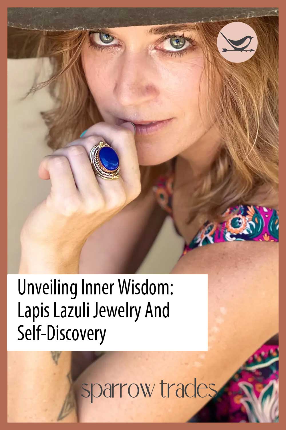 Close-up of a woman wearing a bold lapis lazuli ring and hat, symbolizing inner wisdom and spiritual self-discovery through crystal jewelry.