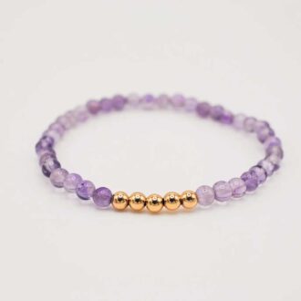Amethyst beaded stretch bracelet with five small gold-filled accent beads