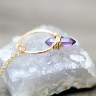 14k gold-filled necklace with a wire-wrapped amethyst point on a small gold hoop