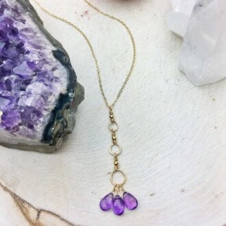 Gold-filled chain with a pendant of three amethyst teardrop drops and hoop accents