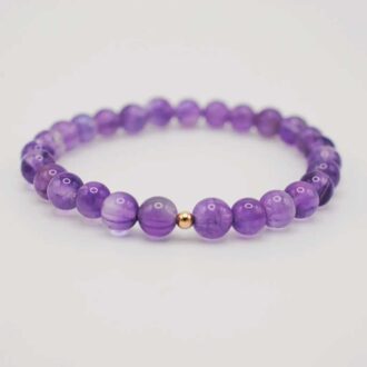 6mm amethyst beaded stretch bracelet with a single gold-filled accent bead