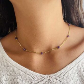 Anthéa Lepidolite necklace with 4mm purple beads on a gold chain, designed for serenity, purification, and spiritual balance.