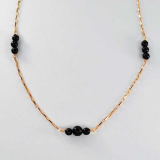Black Onyx Genesis Necklace with polished beads and a 14K gold-filled chain.