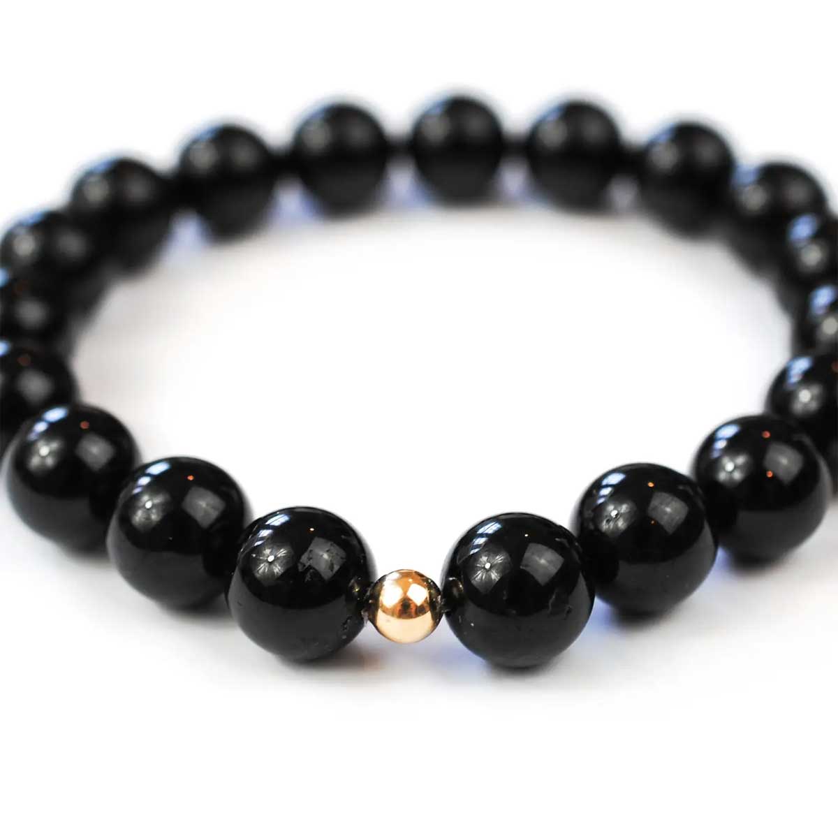Black Onyx beaded bracelet with one gold-filled bead centerpiece.