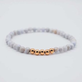 Blue lace agate ascension bracelet with soft blue beads and gold accents.