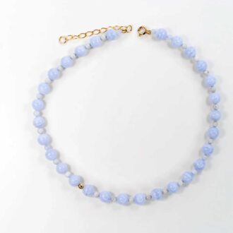 Blue lace agate infinity grande choker with soft blue beads and a single gold accent.