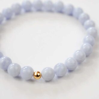 Blue lace agate bracelet with soothing pale blue beads and a single accent bead.