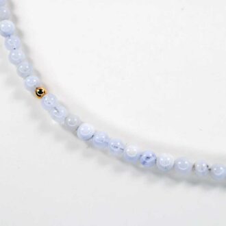 Blue lace agate solo mini choker with soft blue beads and a single accent detail.