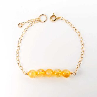 Gold-filled chain bracelet with a bar of round citrine beads and a spring-ring clasp with extender
