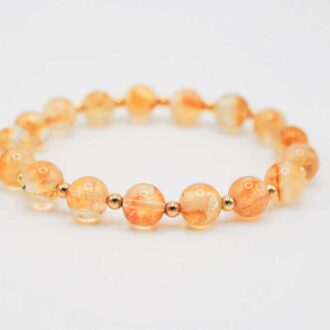 Stretch bracelet of 8 mm citrine beads with tiny gold-filled spacers, approx. 7.25″