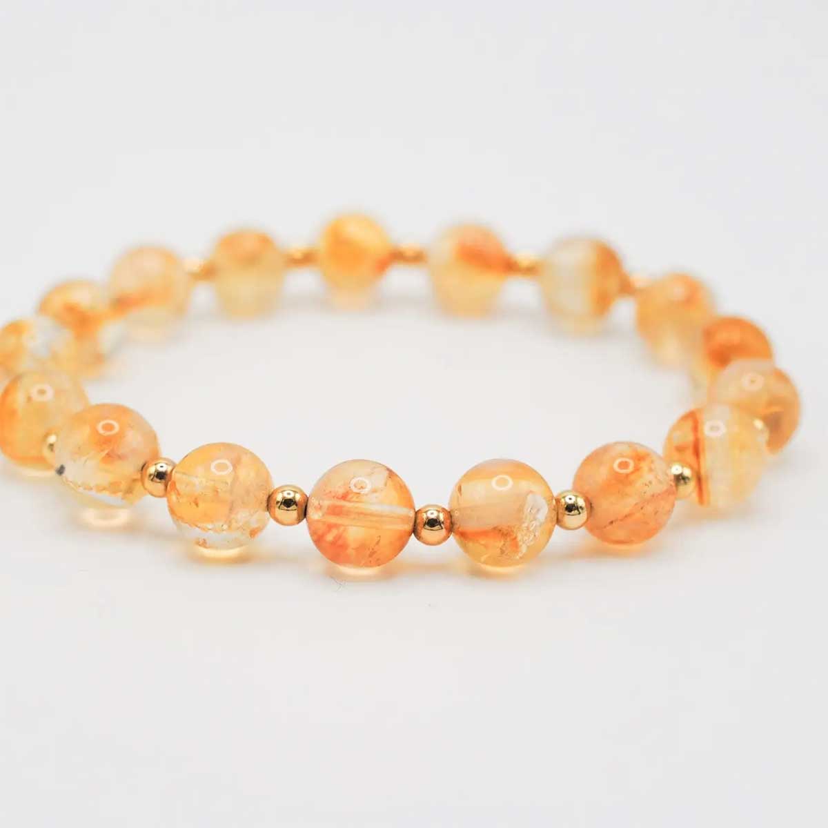 Stretch bracelet of 8 mm citrine beads with tiny gold-filled spacers, approx. 7.25″