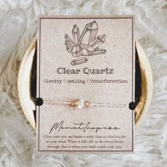 Clear quartz crystal wish bracelet with hemp cord and gold beads on inspiration card