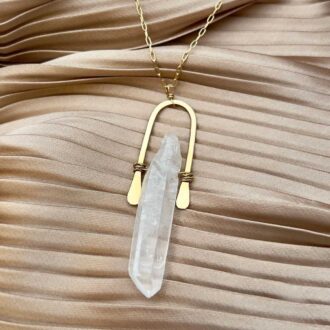 Handmade gold-filled necklace featuring a raw clear quartz crystal point pendant on an 18-inch chain, designed for grounding and energy renewal.