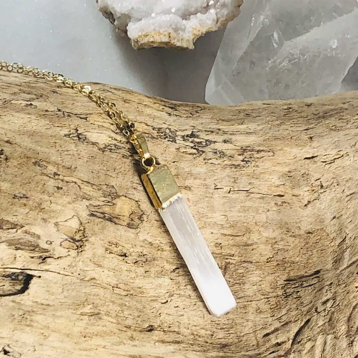 Gold-plated selenite pendant necklace with an adjustable 16–18 inch chain, designed for energy cleansing and clarity.