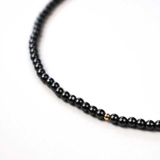 Hematite solo mini choker with gold-filled bead accent