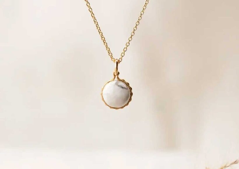 Elegant gold necklace with round howlite pendant, designed for calm, relaxation, and stress relief.
