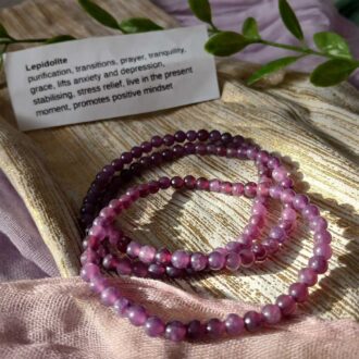 Lepidolite beaded bracelet in soothing purple hues for anxiety relief, mood balance, and calming practices.