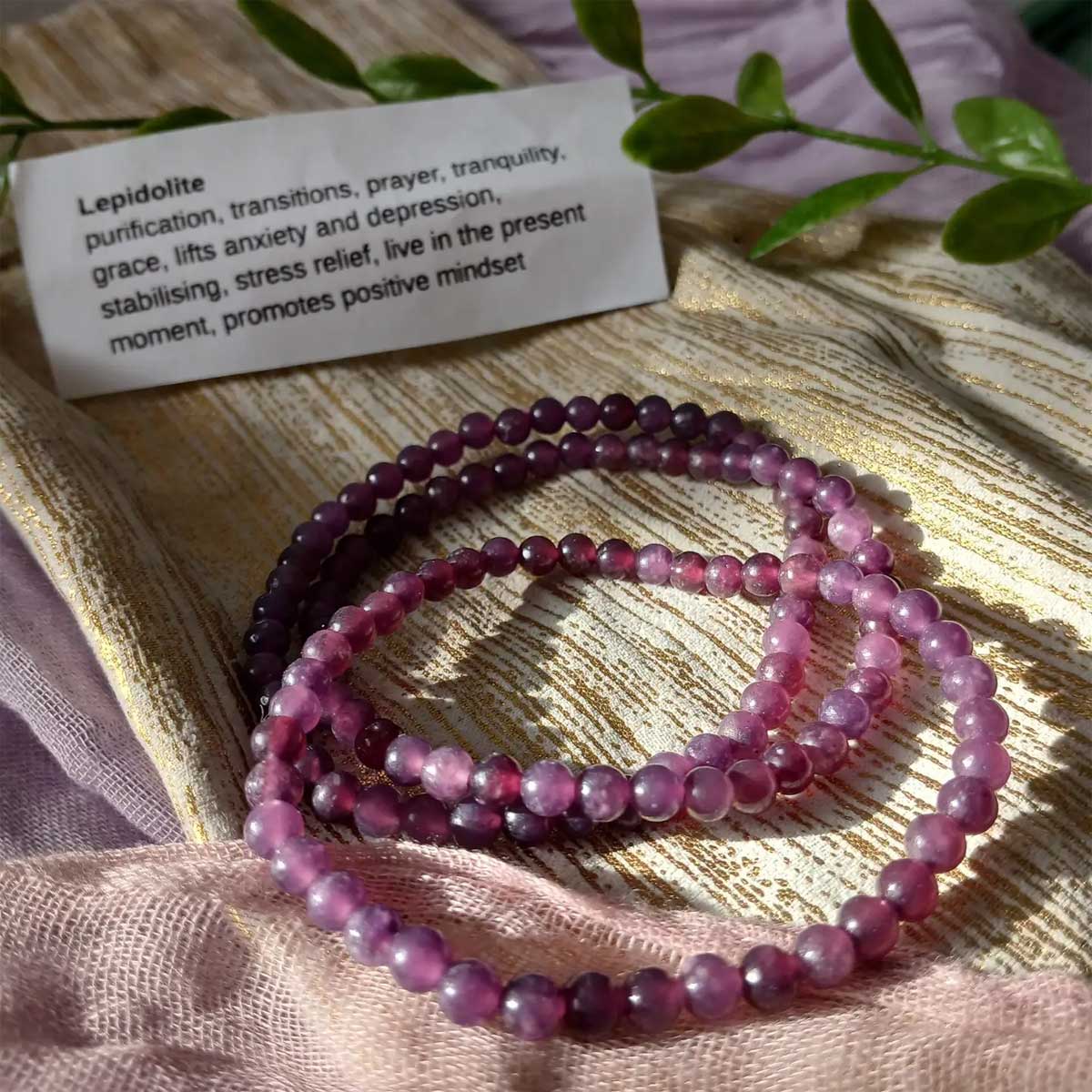 Lepidolite beaded bracelet in soothing purple hues for anxiety relief, mood balance, and calming practices.