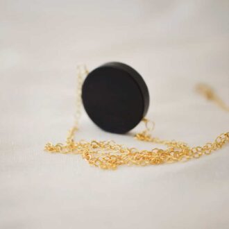 Matte Black Onyx circle pendant necklace with gold-filled chain.