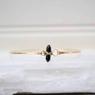 Obsidian Crest Bracelet with gold bangle and double pointed crystal