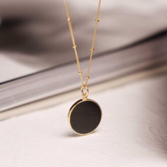 Black obsidian gold circle pendant necklace on satellite chain