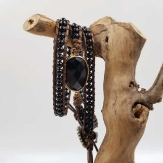 Natural obsidian multilayer chakra bracelet with faceted stone centerpiece and leather wrap design