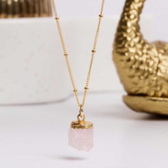 Raw rose quartz pendant on a 14k gold filled satellite chain.