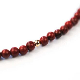 Red Jasper Solo Mini Choker with gold accent bead on a delicate chain.
