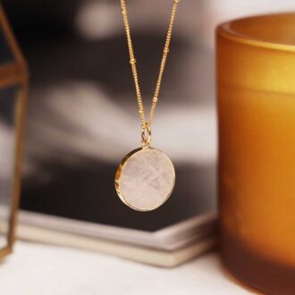 Rose quartz round disc pendant on a 14k gold filled satellite chain.