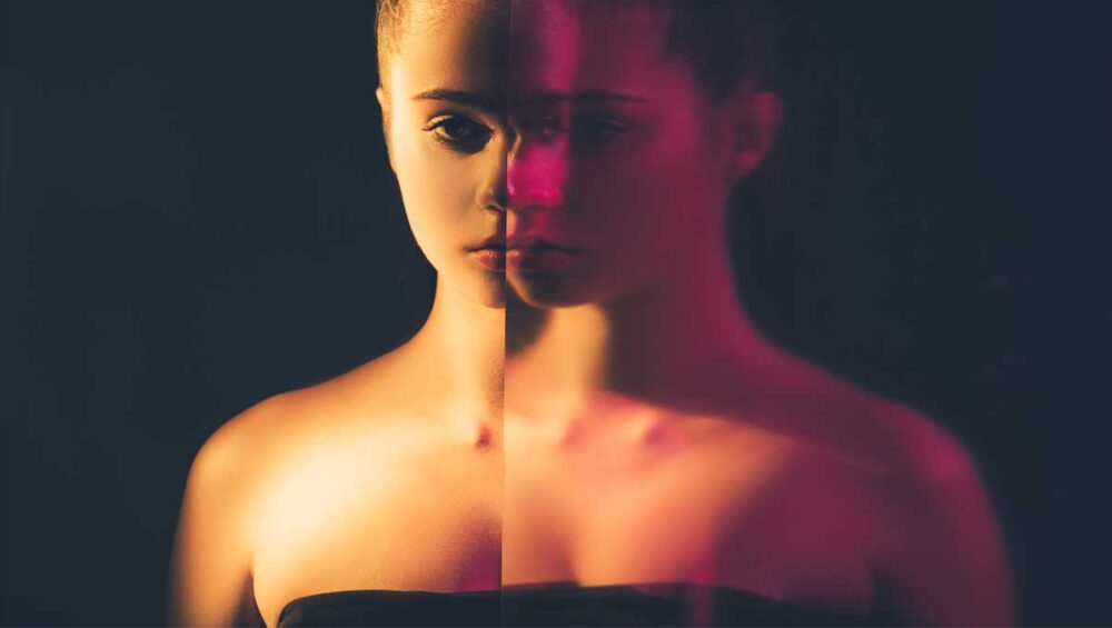 woman with split reflection symbolizing confusion and self-doubt, representing early signs of gaslighting