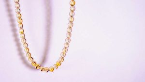 Citrine bead necklace on a soft light background
