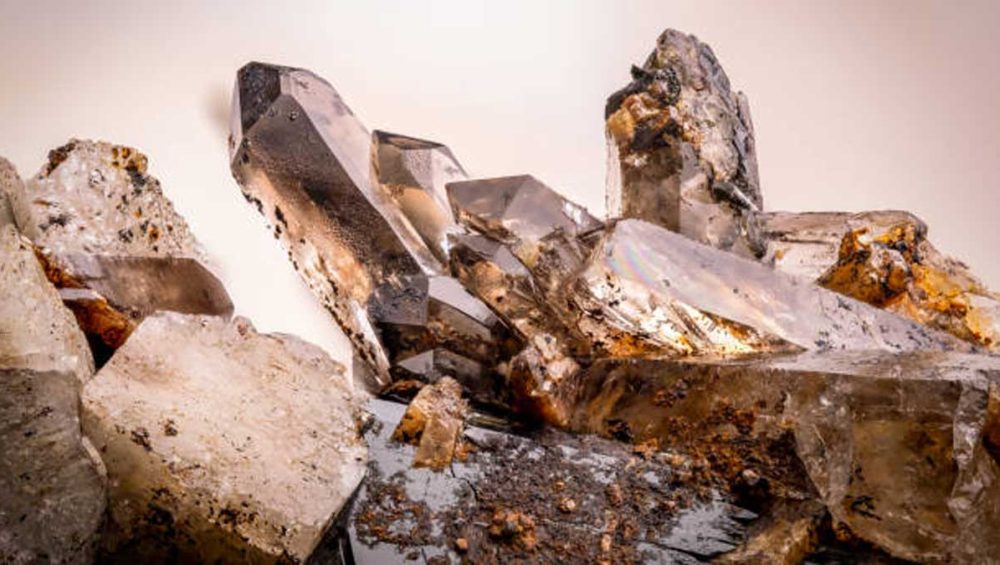 natural smoky quartz crystal cluster with translucent brown tones and mineral inclusions