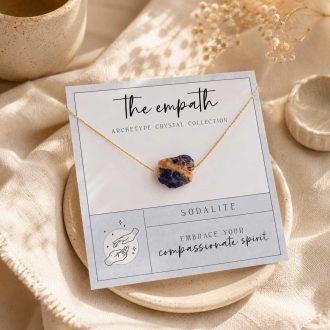 Raw sodalite gemstone necklace displayed on an empathy-themed card with a gold-filled chain and soft neutral background