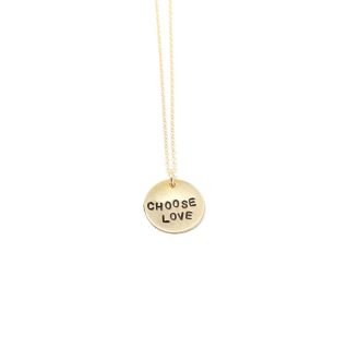 Gold Choose Love pendant necklace on a delicate gold-filled chain against a white background.